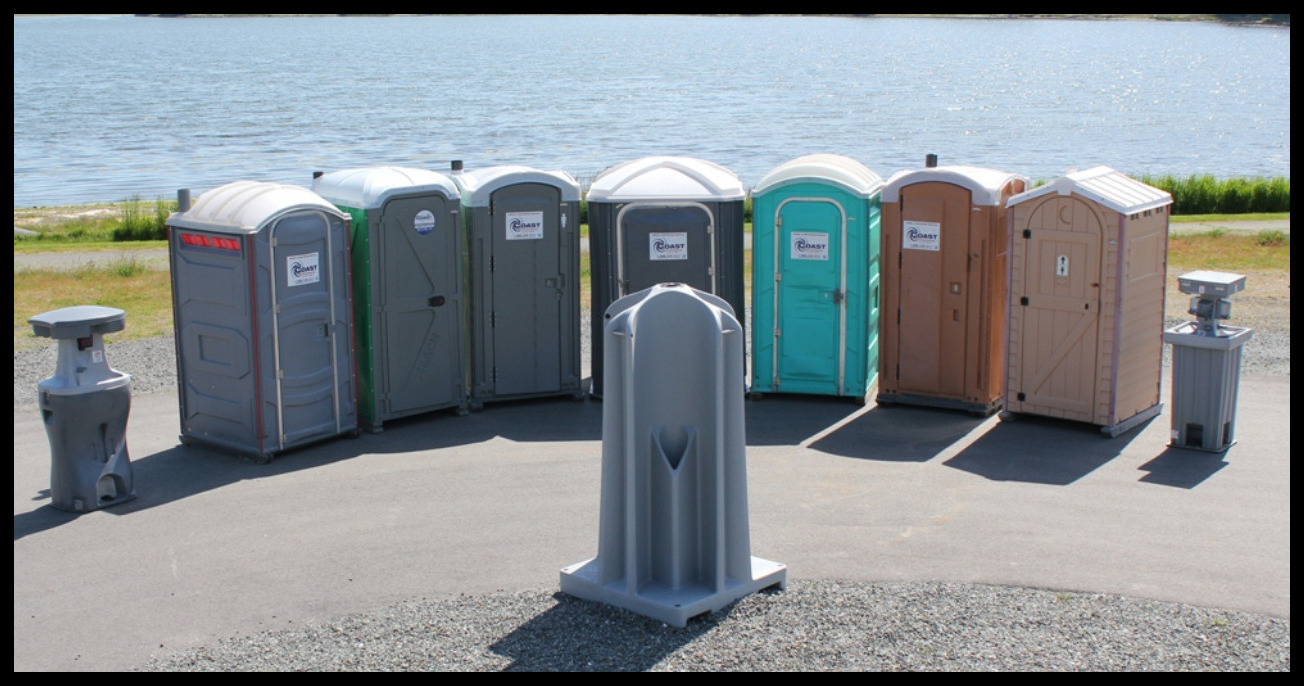line of mobile toilets at an event